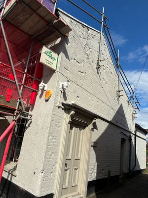 Nearly missed where it was hiding behind the scaffolding - Still open for Business - as they say! at Huggers in Norwich