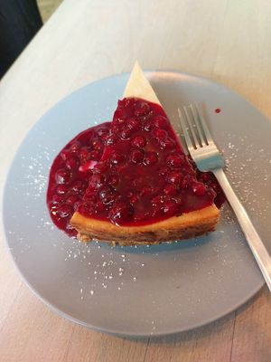 Cheesecake with berry sauce at Impact Café  in Cologne
