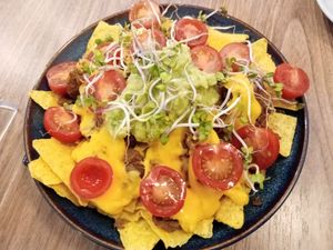loaded nachos with pulled bif, cheeze sauce, avocado, tomatoes and sprouts at Impact Café  in Cologne