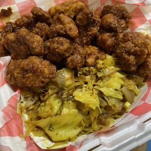 Cauliflower wings combo with curry cabbage. Sauce was sweet teriyaki   at Vegan Planet Café in Norfolk