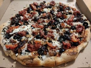 Pizza Urraca (tomatoes, vegan mozzarella, vegan meat, olives, walnuts) at Monkey in Gran Canaria