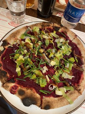 Veganuary pizza with beet and strange sweet sauce  at Berberè - Milano Colonne in Milan