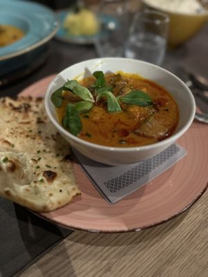 Eggplant curry with garlic naan  at Ginti and More in Cologne