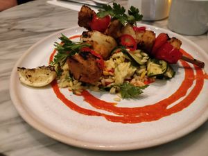 Amba chick’n kebabs - Mango marinated plant chick’n, saffron courgette orzo,
tomato red chilli shatta at Mildreds - Covent Garden in London