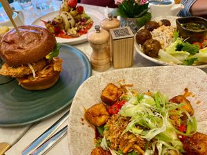 Tempeh ball dish, korean fried chick'n burger, a kebab dish, and a tofu dish at Mildreds - Covent Garden in London