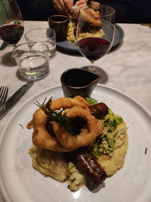 Sausages, mash, cabbage, gravy and onion rings. at Mildreds - Covent Garden in London