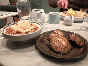 Porridge topped with banana and biscoff; roast mushrooms. at Mildreds - Covent Garden in London
