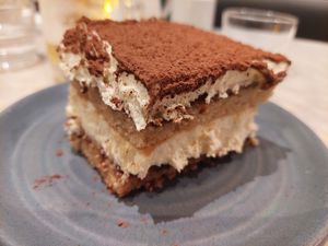 'White Chocolate Tiramisu' - almond sponge cake soaked in coffee layered with white chocolate mousse ($8.50) at Mildreds - Covent Garden in London