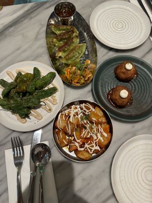 Taste of Mildred’s: Za’atar padron peppers, Kim chi gyoza, arancini rosso, harissa patatas bravas 🤤   at Mildreds - Covent Garden in London