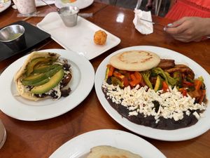 An arepa and a full plate (forgot what it was called)   at Kaxapa Factory in Playa Del Carmen