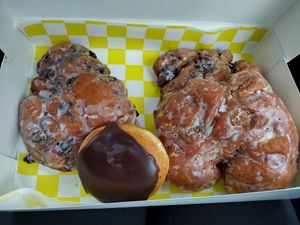 Apple fritter, blueberry fritter, Boston cream. Never had better. at Pacific Donuts in Forest Grove