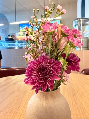 Fresh flowers on the tables at Bonjour Patisserie in San Diego