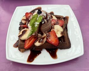 Vegan waffles with ice cream and fruits  at Perezoso Coffee House in Manuel Antonio