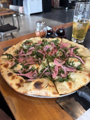Crispy arugula & pickled onions pizzaa  at Iron Goat Brewing in Spokane