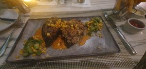 (Entrees) STUFFED POBLANOS:
Quinoa, Charred Corn, Asparagus, Chipotle Tomato Sauce
(Vegan and Gluten Free) at STRAT Café in Las Vegas