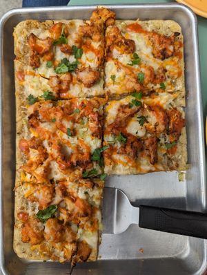 bbq cauliflower gluten free medium pizza minus the first slice I couldn't wait to eat.  stayed nicely warm in the pan at Magdelena's in Petaluma