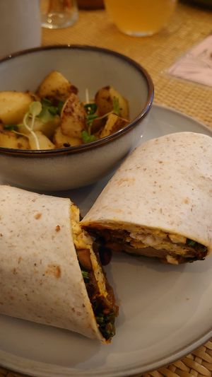 Rise & Shine wrap with herby potatoes at Rise Plant Kitchen + Movement Studio in Malvern