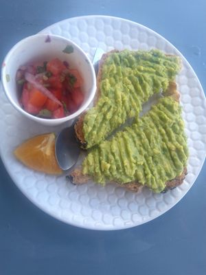 Avocado toast with pico de gallo at Marea Surf Shop Cafe in Samara