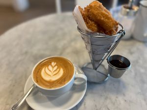 Churros con chocolate + Cappuccino (only on weekends in winter) at Vrote in Montevideo