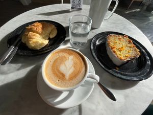 Stuffed croissant, carrot cake and cappuccino at Vrote in Montevideo