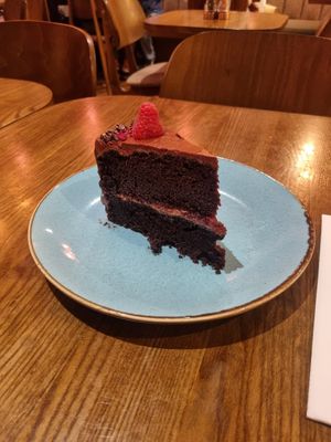 Amazing vegan chocolate raspberry cake!! Beetroot hummus was good too. at Cherry On in West London
