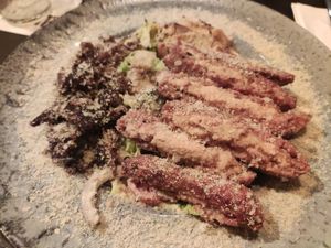 Caesar salad with redefine meat and la-feta burger at Alpaca Bar in Tel Aviv