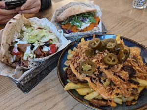 Clockwise, from the bottom: Loaded fries (Amazing, they have a kick!) + Veganitas Berlin K'Bab (super filling and well balanced taste!) + The Wood Smoked Salm'N (unique taste). at Veganitas in Zurich