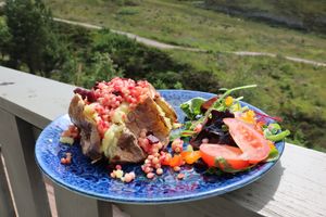 Spiced beetroot & sweet pepper cous cous baked potato  at The Cairngorm Cafe in Aviemore
