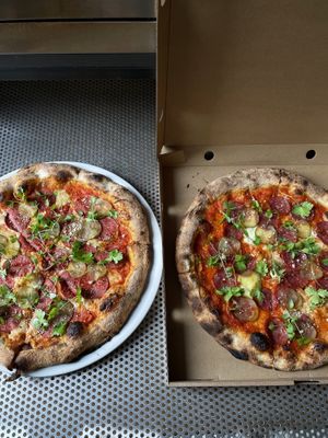 Regular and plant based sausage pizzas.  at ČAU in Riga