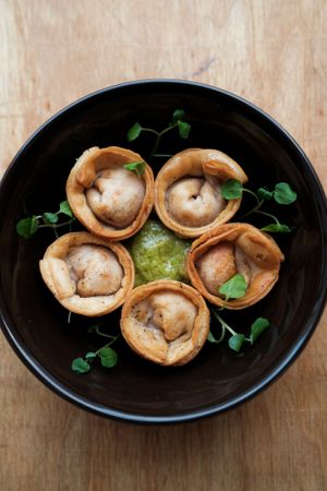 Hand made dumplings with local soy bean tofu and stewed cabbage. at ČAU in Riga