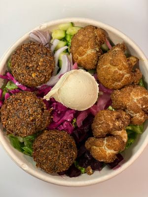 Vegan double protein customized bowl - hawayej cauliflower & house made falafel with super smooth house made hummus.  at Meze Morada in Islamorada