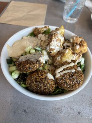 Best meal I’ve had in the Keys! Fried cauliflower, falafel, cucumbers, onions, lettuce, hummus. Our waitress was super cool and friendly, and was also vegan which was exciting.  at Meze Morada in Islamorada