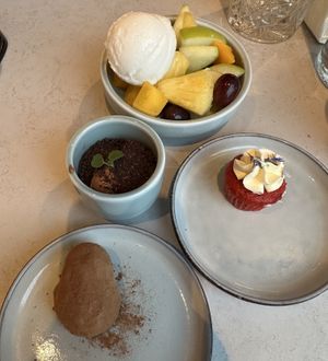 Fruit bowl, Rozey’s garden, mini red velvet cupcake, truffle. All vegan.  at Rozey in Amersfoort
