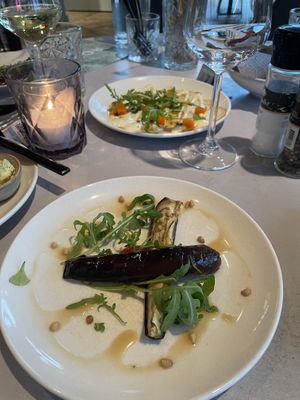Cold aubergine dish, celeriac carpaccio in the background   at Rozey in Amersfoort