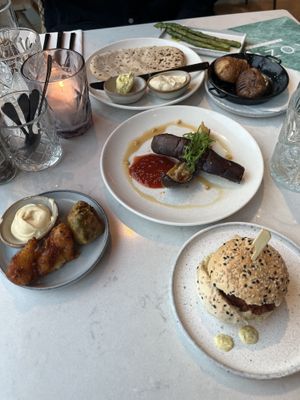 Slider / mini burger, pakora, fried eggplant, flatbread with hummus, potatoes, asparaguss  at Rozey in Amersfoort