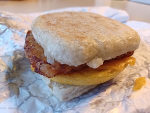 Hashbrown, egg and cheese on English muffin at Vegan Pastry Lab in Englewood