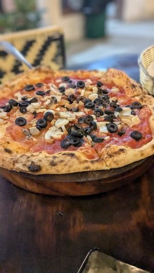 🍕 Pizza Marinara (without anchovies) 17k - toppings are extra 1k each (Olives & Champignons) at Fatto in Casa  in Taganga