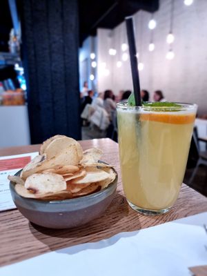 Drinks and salted crisps at NOMAD in Bruges