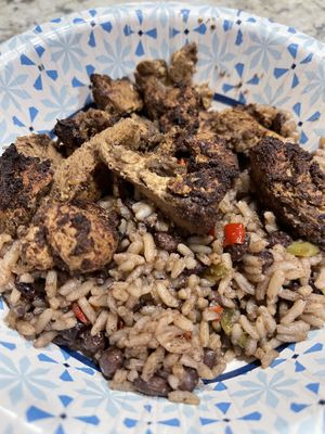 Jerk chicken (legit jerk flavor!) and rice and peas. Delicious !  at Atlas Monroe in San Diego