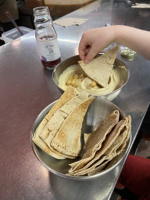 Little one about to dip into some hummuss  at Plantamientos in Madrid