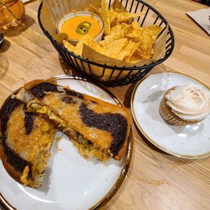 "Rooben Sandwich", chips and queso, and a cupcake.  at Kind Food in Kansas City