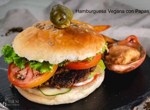 Veggie burger. The patty is garbanzos, lentils, chia seeds,  and sesame seeds. at Tulsi Cafe y Plantas in Ciudad Colon