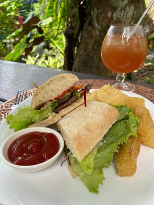 We offer a variety of sandwiches: mushroom, tofu with pesto, falafel, and seitan. With your choice of potato wedges, fried yuca, or salad. at Tulsi Cafe y Plantas in Ciudad Colon