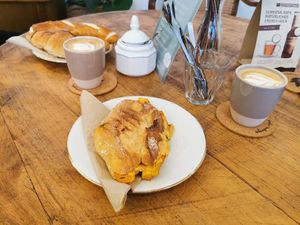 Warmer Flammkuchen-Panini, Laugenstange mit Frischkäse, Schokoschnute, 2 kleine Cappuchinos at Hempies - Händelstraße in Cologne