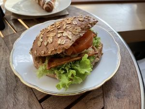 Bread roll with vegan bacon and curry lentil spread - Hempies, Cologne  at Hempies - Händelstraße in Cologne