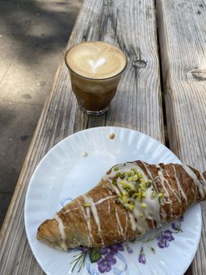 Croissant filled with pistachios and flat white   at Hempies - Händelstraße in Cologne