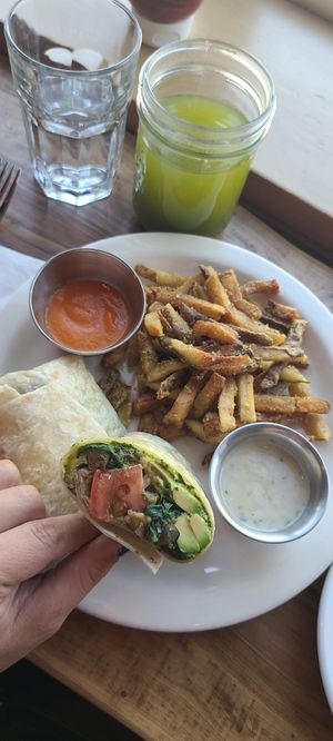 Fresh juice and satisfying SOL burrito. 100% vegan 100% delightful at Soluna Cafe in Jackson
