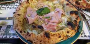 Vegan pizza with pistacchio and vegan mortadella. at Assaje in Trieste