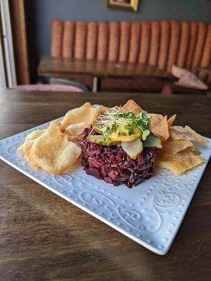 beet and mushroom tartare with yolk, house pickles, and micro greens with fried wontons at The Attic Bar & Stage in Calgary