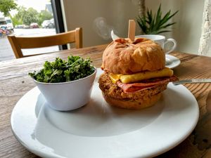 Fried Soy Chicken Bfast Burger with kale side salad  at Rabbits Cafe - Killingsworth in Portland